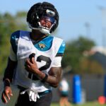 Jacksonville Jaguars wide receiver Travis Hunter (12) reacts during practices as cornerback Jarrian Jones (22) looks on during an NFL training camp session at the Miller Electric Center, Wednesday, Aug. 6, 2025, in Jacksonville, Fla. [Corey Perrine/Florida Times-Union]