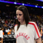 Aug 7, 2025; Phoenix, Arizona, USA; Indiana Fever injured guard Caitlin Clark in attendance against the Phoenix Mercury during an WNBA game at PHX Arena. Mandatory Credit: Mark J. Rebilas-Imagn Images