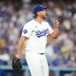 Aug 8, 2025; Los Angeles, California, USA; Los Angeles Dodgers starting pitcher Clayton Kershaw (22) reacts after the end of the second inning against the Toronto Blue Jays at Dodger Stadium.