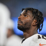 Aug 8, 2025; Charlotte, North Carolina, USA; Cleveland Browns quarterback Shedeur Sanders (12) looks at the scoreboard during the second half against the Carolina Panthers at Bank of America Stadium.