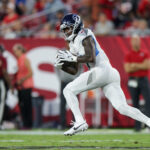 Aug 9, 2025; Tampa, Florida, USA; Tennessee Titans wide receiver Calvin Ridley (0) runs with the ball against the Tampa Bay Buccaneers in the second quarter during a preseason game at Raymond James Stadium. Mandatory Credit: Nathan Ray Seebeck-Imagn Images