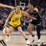 Aug 9, 2025; San Francisco, California, USA; Los Angeles Sparks guard Kelsey Plum (10) dribbles around Golden State Valkyries guard Veronica Burton (22) during the fourth quarter at Chase Center. Mandatory Credit: D. Ross Cameron-Imagn Images