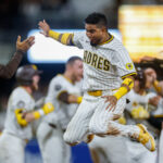 Aug 9, 2025; San Diego, California, USA; San Diego Padres first baseman Luis Arraez (4) celebrates after the Padres walk-off the Boston Red Sox at Petco Park. Mandatory Credit: David Frerker-Imagn Images