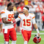 Aug 9, 2025; Glendale, Arizona, USA; Kansas City Chiefs defensive tackle Chris Jones (95) with quarterback Patrick Mahomes (15) against the Arizona Cardinals during a preseason NFL game at State Farm Stadium. Mandatory Credit: Mark J. Rebilas-Imagn Images