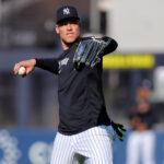 Aug 11, 2025; Bronx, New York, USA; New York Yankees designated hitter Aaron Judge (99) throws a ball in the outfield before a game against the Minnesota Twins at Yankee Stadium. Mandatory Credit: Brad Penner-Imagn Images