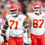 Aug 9, 2025; Glendale, Arizona, USA; Kansas City Chiefs offensive tackle Josh Simmons (71) and tight end Travis Kelce (87) against the Arizona Cardinals during a preseason NFL game at State Farm Stadium. Mandatory Credit: Mark J. Rebilas-Imagn Images