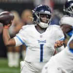 Aug 15, 2025; Atlanta, Georgia, USA; Tennessee Titans quarterback Cameron Ward (1) passes the ball against the Atlanta Falcons during the first half at Mercedes-Benz Stadium.