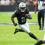 Aug 16, 2025; Paradise, Nevada, USA; Raiders running back Ashton Jeanty (2) rushes against the San Francisco 49ers during the first quarter at Allegiant Stadium. Mandatory Credit: Stephen R. Sylvanie-Imagn Images