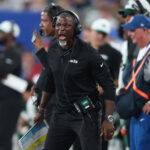 Aug 16, 2025; East Rutherford, New Jersey, USA; New York Jets head coach Aaron Glenn reacts during the first half against the New York Giants at MetLife Stadium. Mandatory Credit: Vincent Carchietta-Imagn Images