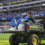 Aug 16, 2025; Inglewood, California, USA; Los Angeles Chargers wide receiver Quentin Johnston (1) reacts after being driven away with an injury against the Los Angeles Rams during the first quarter at SoFi Stadium. Mandatory Credit: Jonathan Hui-Imagn Images