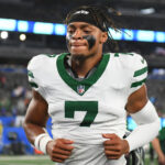 Aug 16, 2025; East Rutherford, New Jersey, USA; New York Jets quarterback Justin Fields (7) jogs off the field following a game against the New York Giants at MetLife Stadium. Mandatory Credit: Rich Barnes-Imagn Images