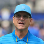 Aug 16, 2025; Inglewood, California, USA; Los Angeles Chargers coach Jim Harbaugh reacts during the game against the Los Angeles Rams at SoFi Stadium. Mandatory Credit: Kirby Lee-Imagn Images