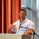 Aug 20, 2025; Augusta, Georgia, USA; Tim Tebow, former NFL quarterback and Co-Owner of Augusta Pro Hockey, speaks during the announcement for Augusta Pro Hockey at the Bell Auditorium. ECHL hockey will return to Augusta for the 2027-2028 season. Mandatory Credit: Katie Goodale - Augusta Chronicle/USA TODAY NETWORK