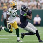 Seattle Seahawks wide receiver Marquez Valdes-Scantling (1) grabs a pass while being covered by Seattle Seahawks cornerback Damarion Williams (37) during the second quarter of their preseason game Saturday, August 23, 2025 at Lambeau Field in Green Bay, Wisconsin.