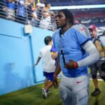 Tennessee Titans quarterback Cam Ward (1) exits the field after an NFL pre-season game against the Minnesota Vikings at Nissan Stadium in Nashville, Tenn., Friday, Aug. 22, 2025.