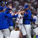Aug 26, 2025; New York City, New York, USA; New York Mets outfielder Brandon Nimmo (9) celebrates with teammates after hitting a walk off single against the Philadelphia Phillies during the ninth inning at Citi Field. Mandatory Credit: John Jones-Imagn Images