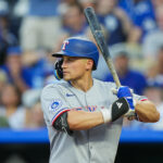 Aug 18, 2025; Kansas City, Missouri, USA; Texas Rangers shortstop Corey Seager (5) bats during the third inning against the Kansas City Royals at Kauffman Stadium. Mandatory Credit: Jay Biggerstaff-Imagn Images