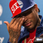 Apr 8, 2016; Philadelphia, PA, USA; Philadelphia 76ers legend Allen Iverson wipes tears away as he talks about his selection for enshrinement in the Naismith Memorial Basketball Hall of Fame as a member of the Class of 2016 during a press conference at Wells Fargo Center. Mandatory Credit: Bill Streicher-USA TODAY Sports