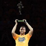May 11, 2016; Oakland, CA, USA; Golden State Warriors guard Stephen Curry (30) hoists the MVP trophy before game five of the second round of the NBA Playoffs against the Portland Trail Blazers at Oracle Arena. Mandatory Credit: Kyle Terada-USA TODAY Sports