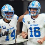 Detroit Lions receiver Amon-Ra St. Brown (14) and quarterback Jared Goff (16) celebrate after completing a hook and ladder play for a touchdown to teammate Jahmyr Gibbs (not pictured) during their game against the Arizona Cardinals at State Farm Stadium in Glendale, Ariz., Sep 22, 2024.