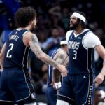 Apr 2, 2025; Dallas, Texas, USA; Dallas Mavericks forward Anthony Davis (3) celebrates with Dallas Mavericks center Dereck Lively II (2) after scoring during the fourth quarter against the Atlanta Hawks at American Airlines Center.