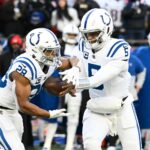 Dec 1, 2024; Foxborough, Massachusetts, USA; Indianapolis Colts quarterback Anthony Richardson (5) hands the ball off to running back Jonathan Taylor (28) during the second half against the New England Patriots at Gillette Stadium.