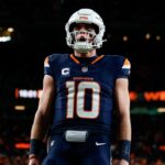 Dec 2, 2024; Denver, Colorado, USA; Denver Broncos quarterback Bo Nix (10) reacts after a play in the third quarter against the Cleveland Browns at Empower Field at Mile High.