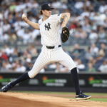 Jul 9, 2025; Bronx, New York, USA; New York Yankees starting pitcher Cam Schlitter (31) pitches in the first inning against the against the Seattle Mariners at Yankee Stadium.