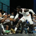 Aug 10, 2024; Paris, France; Germany point guard Dennis Schroder (17) jumps towards the seat after making a play for the ball against Serbia in the men's basketball bronze medal game during the Paris 2024 Olympic Summer Games at Accor Arena.
