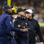 Dec 4, 2021; Indianapolis, IN, USA; Michigan Wolverines offensive line coach Sherrone Moore (left), head coach Jim Harbaugh (center) and special teams coordinator Jay Harbaugh against the Iowa Hawkeyes in the Big Ten Conference championship game at Lucas Oil Stadium.