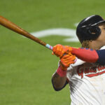 Aug 12, 2025; Cleveland, Ohio, USA; Cleveland Guardians third baseman Jose Ramirez (11) hits a solo home run in the eighth inning against the Miami Marlins at Progressive Field.