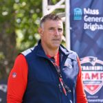 Jul 28, 2025; Foxborough, MA, USA; New England Patriots head coach Mike Vrabel heads to the practice fields for training camp at Gillette Stadium.