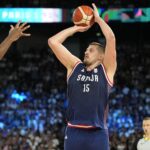 Aug 8, 2024; Paris, France; Serbia power forward Nikola Jokic (15) shoots the ball during the first half against the United States in a men's basketball semifinal game during the Paris 2024 Olympic Summer Games at Accor Arena.