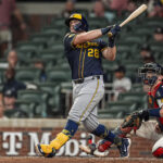 Aug 6, 2025; Cumberland, Georgia, USA; Milwaukee Brewers first base Andrew Vaughn (28) bats against the Atlanta Braves during the ninth inning at Truist Park.