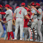 Sep 15, 2025; Los Angeles, California, USA; Philadelphia Phillies celebrate the victory against the Los Angeles Dodgers and clinching the National League East division title at Dodger Stadium. Mandatory Credit: Gary A. Vasquez-Imagn Images