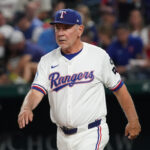 Sep 23, 2025; Arlington, Texas, USA; Texas Rangers manager Bruce Bochy (15) walks to the mound for a pitching change during the fourth inning against the Minnesota Twins at Globe Life Field. Mandatory Credit: Raymond Carlin III-Imagn Images