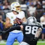Sep 15, 2025; Paradise, Nevada, USA; Los Angeles Chargers quarterback Justin Herbert (10) drops back to pass during the first quarter against the Las Vegas Raiders at Allegiant Stadium.