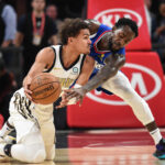 Nov 19, 2018; Atlanta, GA, USA; Atlanta Hawks guard Trae Young (11) protects the ball from LA Clippers guard Patrick Beverley (21) during the first half at State Farm Arena. Mandatory Credit: Dale Zanine-USA TODAY Sports