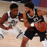 Sep 1, 2020; Lake Buena Vista, Florida, USA; Denver Nuggets guard Jamal Murray (27) controls the ball against Utah Jazz guard Donovan Mitchell (45) during the second half of game seven of the first round of the 2020 NBA Playoffs at ESPN Wide World of Sports Complex.