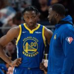 October 30, 2021; San Francisco, California, USA; Golden State Warriors forward Jonathan Kuminga (00) listens to forward Draymond Green (23) during the fourth quarter against the Oklahoma City Thunder at Chase Center.
