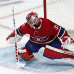 Apr 19, 2022; Montreal, Quebec, CAN; Montreal Canadiens goaltender Carey Price (31) makes a save against Minnesota Wild during the first period at Bell Centre. Mandatory Credit: Jean-Yves Ahern-USA TODAY Sports