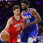 Feb 13, 2023; Philadelphia, Pennsylvania, USA; Houston Rockets center Alperen Sengun (28) drives to the basket against Philadelphia 76ers center Joel Embiid (21) at Wells Fargo Center. Mandatory Credit: Eric Hartline-USA TODAY Sports