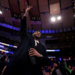 Jan 17, 2024; New York, New York, USA; New York Knicks former player Carmelo Anthony acknowledges the crowd after being introduced to the fans during the second quarter against the Houston Rockets at Madison Square Garden. Mandatory Credit: Brad Penner-USA TODAY Sports