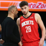 Feb 14, 2024; Memphis, Tennessee, USA; Houston Rockets head coach Ime Udoka (left) talks with center Alperen Sengun (28) during the first half against the Memphis Grizzlies at FedExForum. Mandatory Credit: Petre Thomas-USA TODAY Sports
