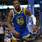 Mar 13, 2024; Dallas, Texas, USA; Golden State Warriors forward Jonathan Kuminga (00) reacts to being fouled during the second half against the Dallas Mavericks at the American Airlines Center.