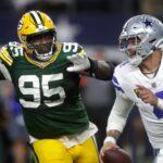 Green Bay Packers defensive tackle Devonte Wyatt (95) rushes Dallas Cowboys quarterback Dak Prescott (4) during the fourth quarter of their wild card playoff game Sunday, January 14, 2024 at AT&T Stadium in Arlington, Texas. Green Bay defeated Dallas 48-32.