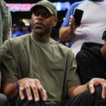 Apr 27, 2024; Orlando, Florida, USA; Orlando Magic former guard Tracy McGrady looks on from the sidelines during a game against the Cleveland Cavaliers in the fourth quarter during game four of the first round for the 2024 NBA playoffs at Kia Center. Mandatory Credit: Nathan Ray Seebeck-USA TODAY Sports