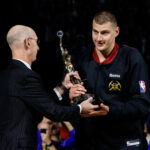 May 14, 2024; Denver, Colorado, USA; NBA commissioner Adam Silver presents Denver Nuggets center Nikola Jokic (15) the KIA NBA MVP trophy before game five against the Minnesota Timberwolves in the second round for the 2024 NBA playoffs at Ball Arena. Mandatory Credit: Isaiah J. Downing-USA TODAY Sports