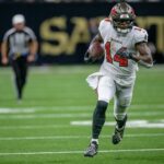 Chris Godwin Oct 13, 2024; New Orleans, Louisiana, USA; Tampa Bay Buccaneers wide receiver Chris Godwin (14) runs in for a touchdown during the third quarter against the New Orleans Saints at Caesars Superdome. Mandatory Credit: Matthew Hinton-Imagn Images