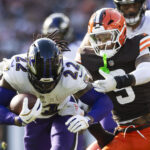 Oct 27, 2024; Cleveland, Ohio, USA; Baltimore Ravens running back Derrick Henry (22) runs the ball as Cleveland Browns safety Grant Delpit (9) tackles him during the fourth quarter at Huntington Bank Field. Mandatory Credit: Scott Galvin-Imagn Images